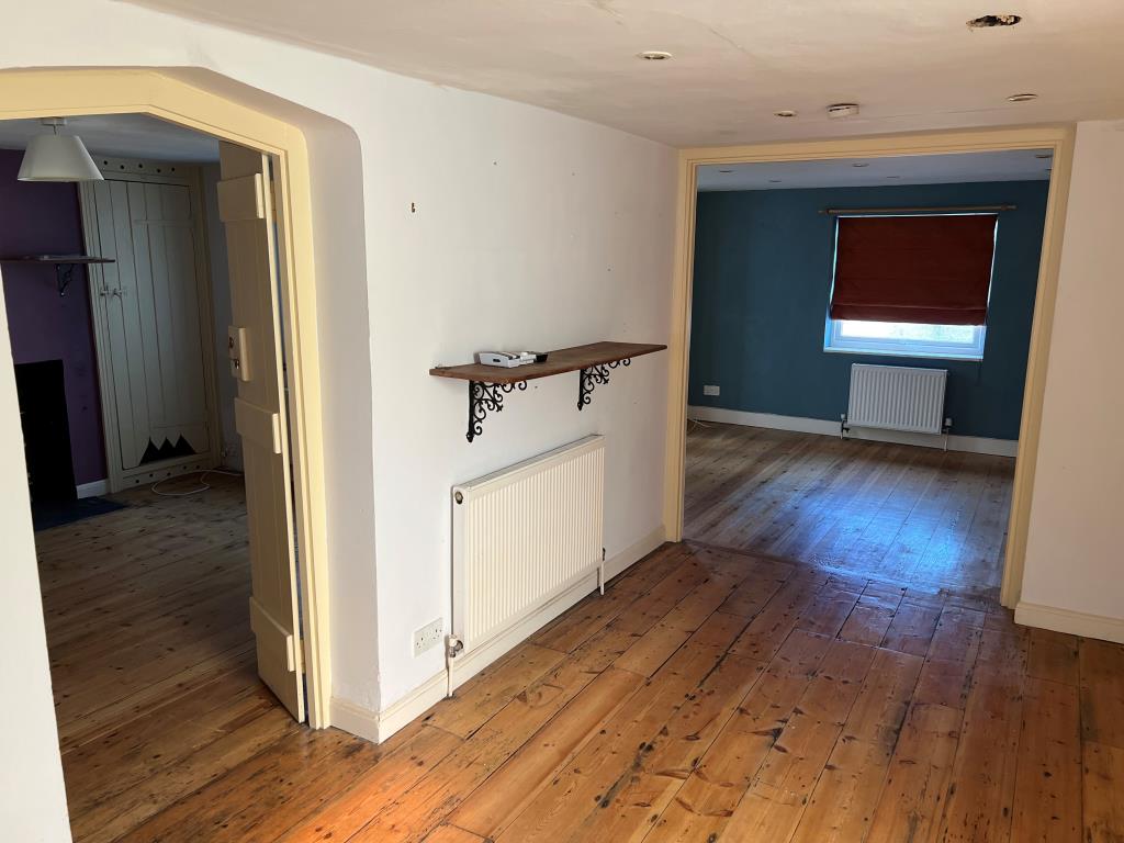 Lot: 74 - THREE-BEDROOM TOWN CENTRE HOUSE FOR IMPROVEMENT - Entrance hall looking into living rooms